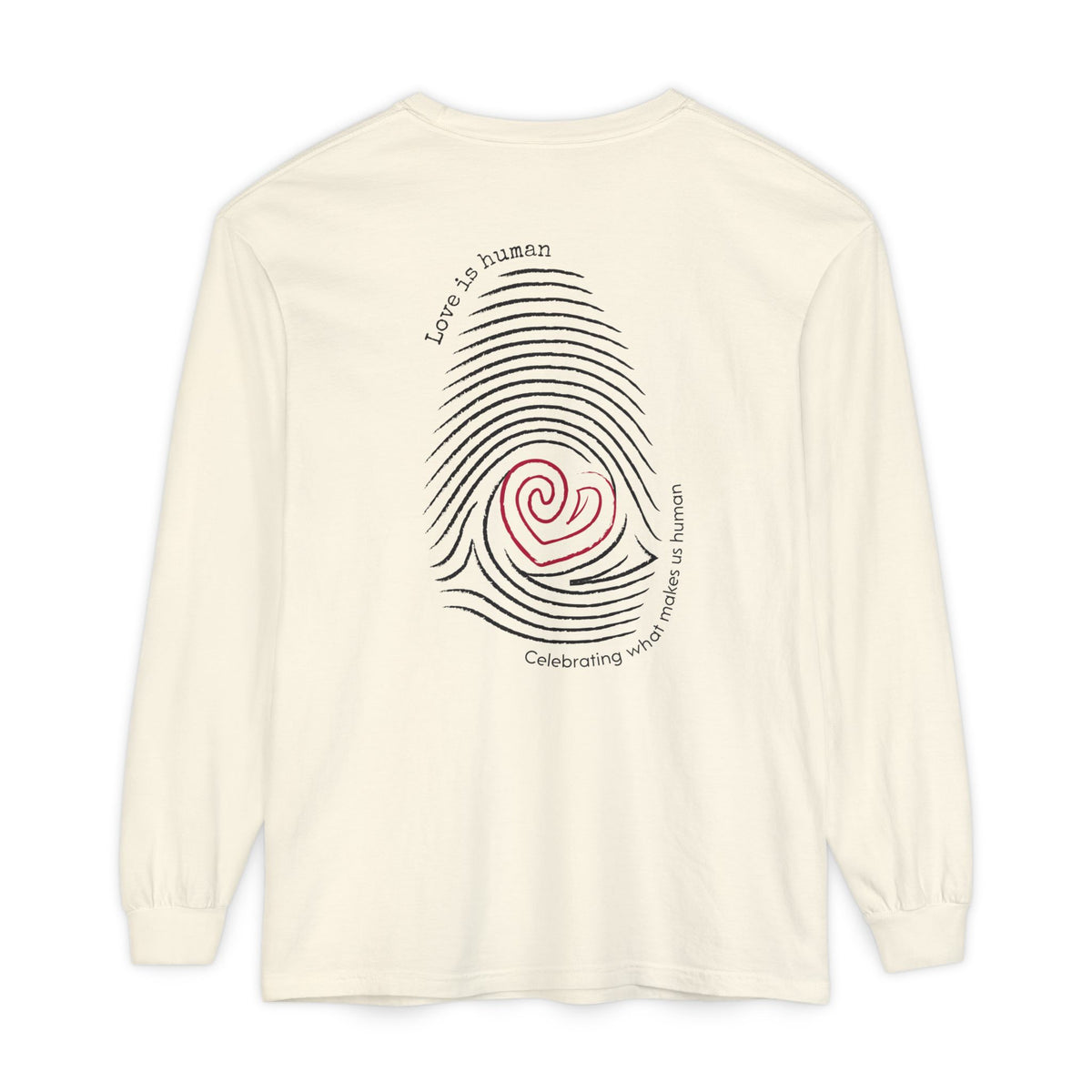 A cream long-sleeve t-shirt with a graphic on the back featuring a black fingerprint pattern, a red heart in the center, and black text that reads 'Love is human' and 'Celebrating what makes us human'.