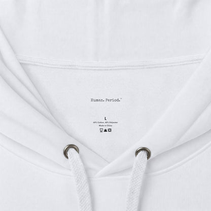 Close-up of a white hoodie showing the inside neck area, drawstrings, and printed inner label text reading 'Human, Period.' with size and care symbols.