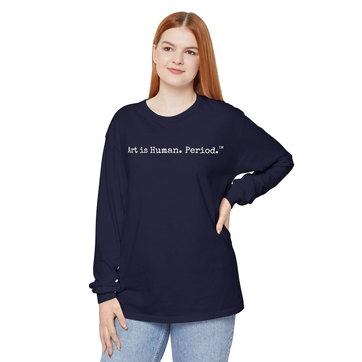 Woman wearing long sleeve tshirt with phrase "Art is Human. Period."