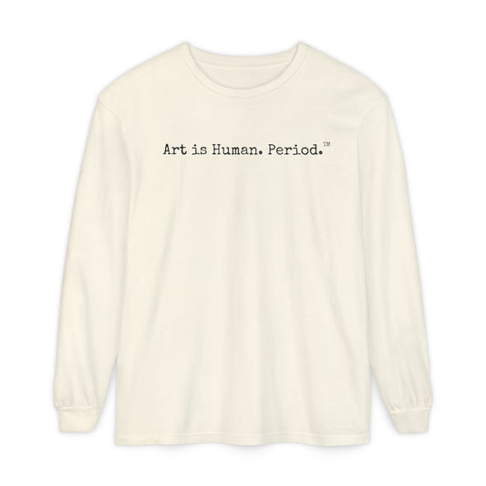 An off-white long-sleeve t-shirt with the text 'Art is Human. Period.