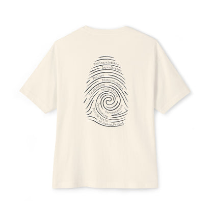 A cream short-sleeve t-shirt with a graphic print of a spiral fingerprint on the back, set against a plain white background. Words like failure, making mistakes, perseverance and overcoming fill the spiral. 