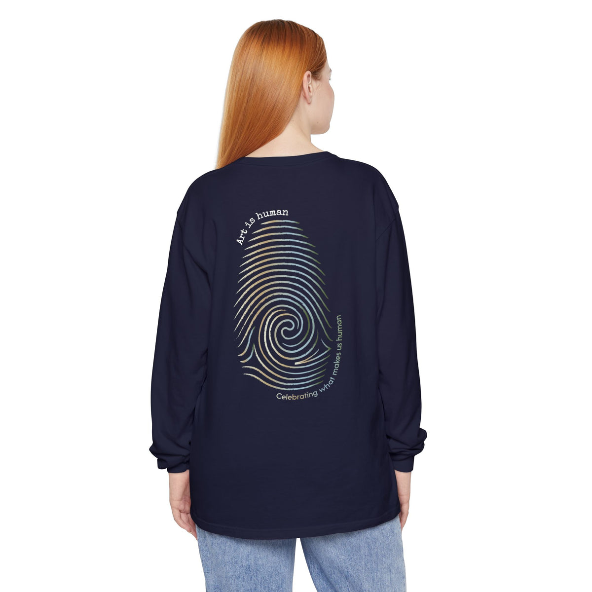 A navy long-sleeve t-shirt shown from the back, featuring a large graphic print of a spiral fingerprint in a multi gradient with the text 'Art Is human' and 'Celebrating what makes us human'.