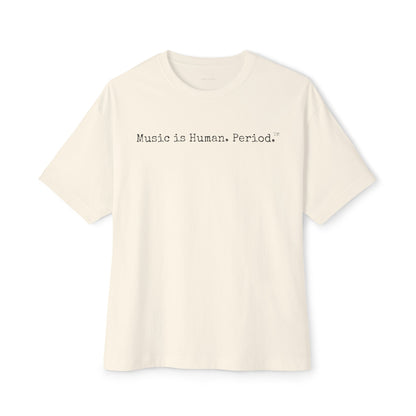 Beige t-shirt with 'Music is Human. Period.' text on a white background