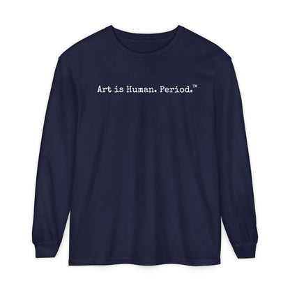 A navy blue long-sleeve t-shirt with the phrase 'Art is Human. Period.