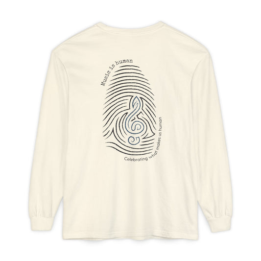 An off-white long-sleeve t-shirt shown from the back, featuring a black graphic of a fingerprint and treble clef with the text 'Music is human' and 'Celebrating what makes us human'.