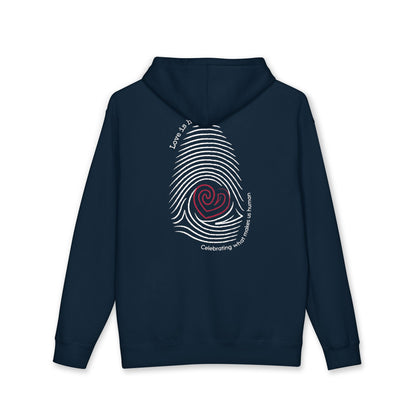 A navy blue hoodie shown from the back, featuring a large white fingerprint graphic with a red spiral center and white text reading 'Love is human'