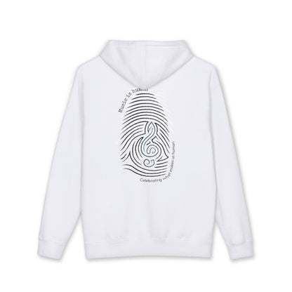 A white pullover hoodie with a black graphic print on the back depicting a fingerprint pattern overlaid with a treble clef and the words Music is Human