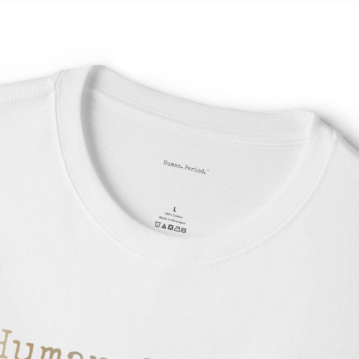 Close-up of a white crewneck t-shirt showing the inner neck label with 'Human Period.' printed inside, along with size 'L' and care instructions.