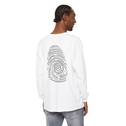 Man wearing a  white  long-sleeve t-shirt with a graphic print of a spiral fingerprint on the back, set against a plain white background. Words like failure, making mistakes, perseverance and overcoming fill the spiral. 