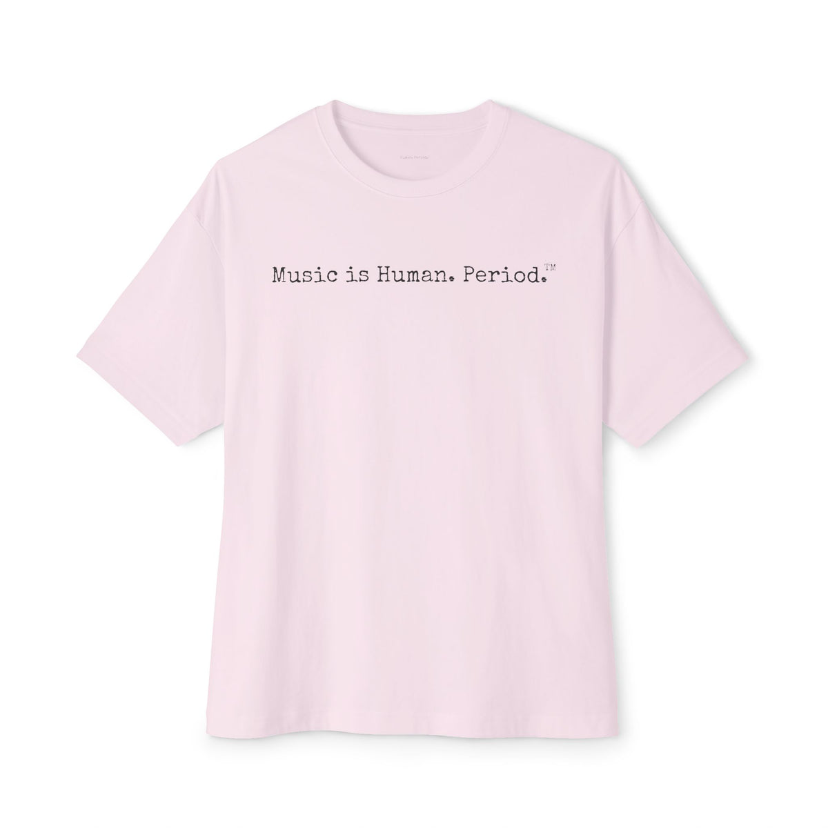 A light pink short-sleeve crewneck t-shirt with the text 'Music is Human, Period.' printed in black typewriter font across the chest, displayed on a clean white background.