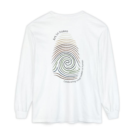 A white long-sleeve t-shirt shown from the back, featuring a colorful spiral fingerprint graphic with the text 'Art is human' and 'Celebrating what make us human'.