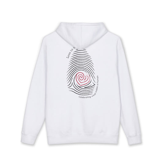 A white pullover hoodie shown from the back, featuring a large graphic print of a black fingerprint with a red spiral heart in the center and curved black text around it. "Love is human"