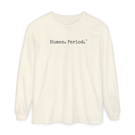 An off-white long-sleeve crewneck t-shirt with the text 'Human.Period.' printed  across the chest, displayed on a clean white background.