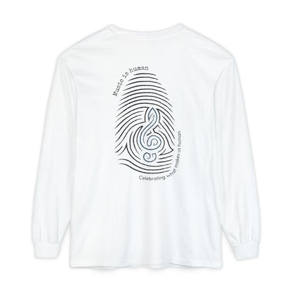 A white long-sleeve t-shirt shown from the back, featuring a black graphic of a fingerprint and treble clef with the text 'Music is human' and 'Celebrating what makes us human'.