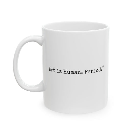 A white ceramic coffee mug with the printed text 'Art is Human. Period.