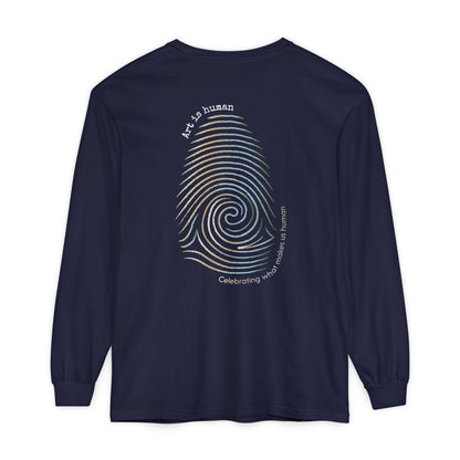 A navy long-sleeve t-shirt shown from the back, featuring a large graphic print of a spiral fingerprint in a multi gradient with the text 'Art Is human' and 'Celebrating what makes us human'.