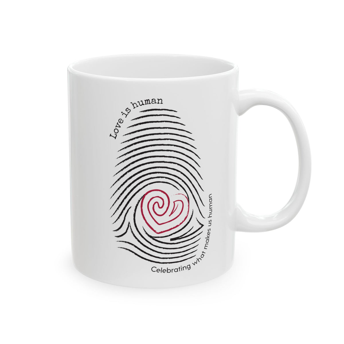 A white ceramic mug featuring a black fingerprint graphic with a red heart at the center and the text 'Love is human' and 'Celebrating what makes us human'.