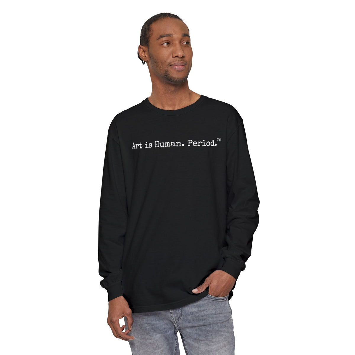 Man wearing long sleeve tshirt with phrase "Art is Human. Period."