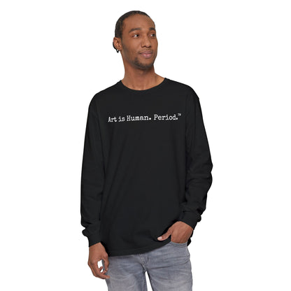 Man wearing long sleeve tshirt with phrase "Art is Human. Period."