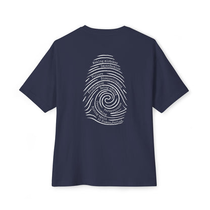 A navy blue short-sleeve t-shirt with a white graphic print of a spiral fingerprint on the back, set against a plain white background. Words like failure, making mistakes, perseverance and overcoming fill the spiral. 